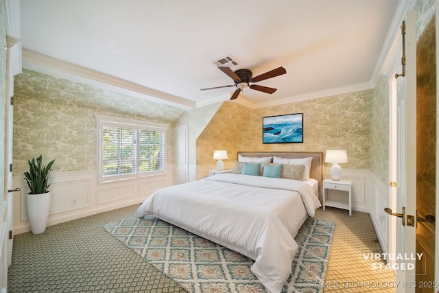 219 E 28th St, Tulsa, OK 74114 - carpeted bedroom featuring ornamental molding, wallpapered walls, wainscoting, a decorative wall, and a ceiling fan