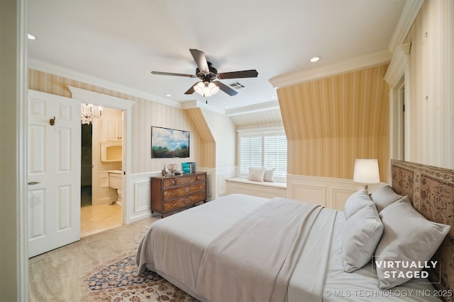 bedroom with wallpapered walls, wainscoting, and ornamental molding