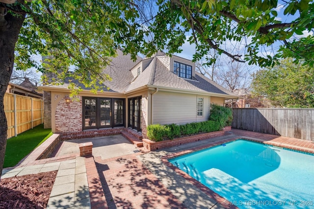 219 E 28th St, Tulsa, OK 74114 - view of pool with a patio area, a fenced backyard, and french doors