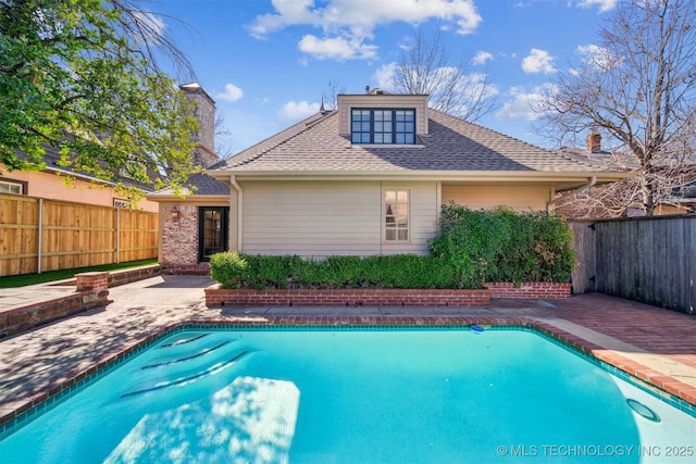 view of swimming pool featuring a patio area, a fenced backyard, and a fenced in pool