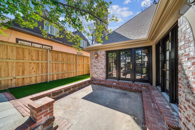 view of patio featuring fence