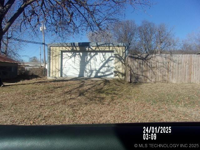 garage featuring fence