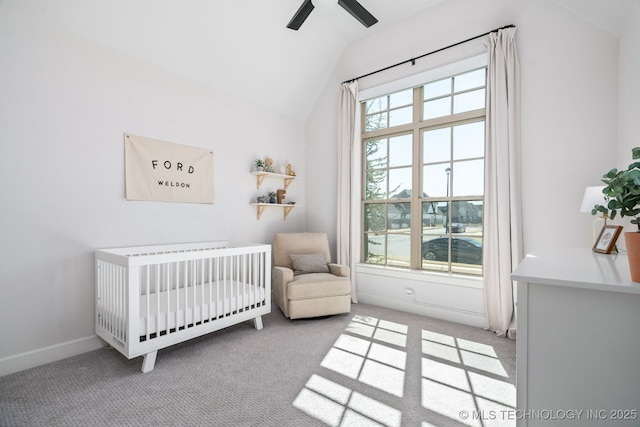 carpeted bedroom featuring a crib, vaulted ceiling, multiple windows, and baseboards