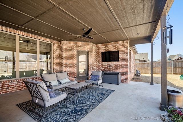 view of patio featuring an outdoor living space, ceiling fan, and fence