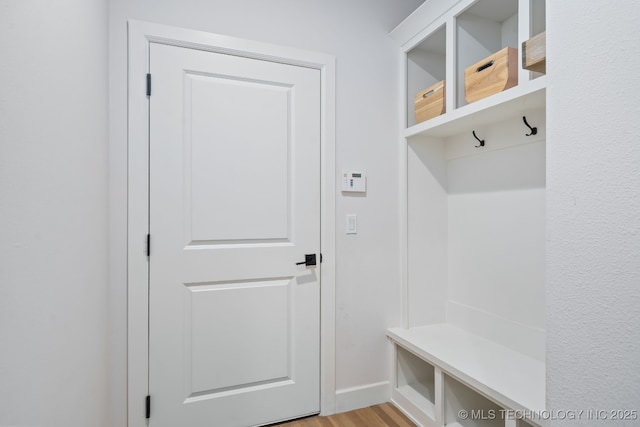 mudroom with light wood finished floors