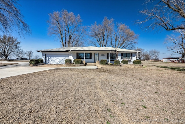 ranch-style home with driveway and an attached garage