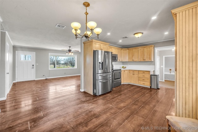 kitchen featuring visible vents, dark wood-type flooring, light brown cabinets, appliances with stainless steel finishes, and light countertops