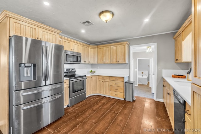 kitchen with light countertops, light brown cabinets, visible vents, and appliances with stainless steel finishes