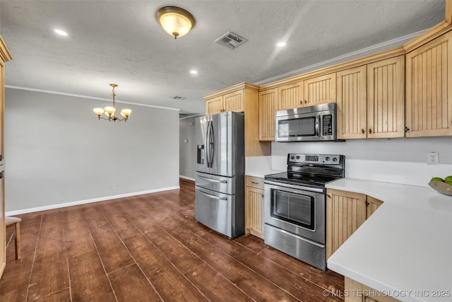 kitchen featuring visible vents, dark wood finished floors, light countertops, an inviting chandelier, and stainless steel appliances