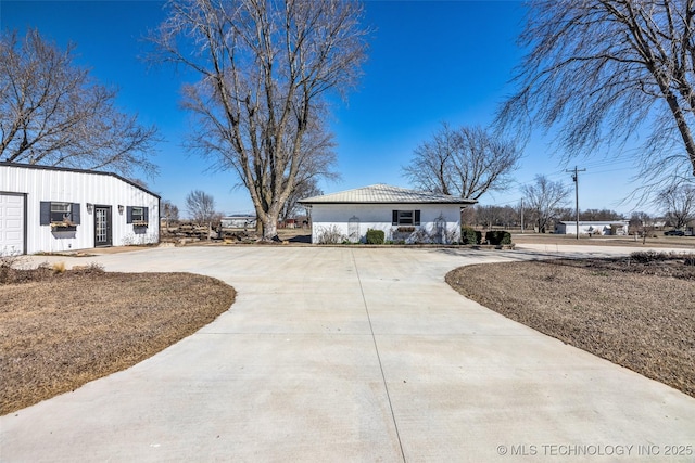 view of yard with curved driveway