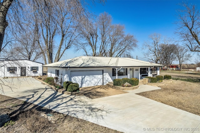 single story home with driveway, brick siding, a porch, and an attached garage