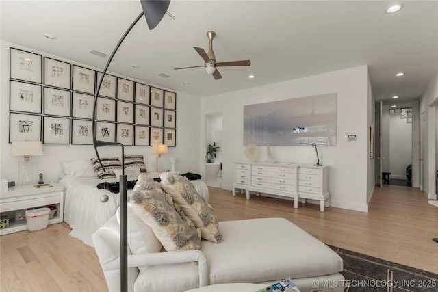 living area with recessed lighting, baseboards, wood finished floors, and ceiling fan