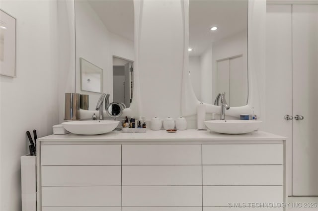 2440 E 47th Pl, Tulsa, OK 74105 - bathroom with double vanity and recessed lighting