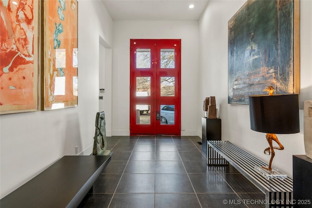 tiled entryway featuring recessed lighting, french doors, and baseboards