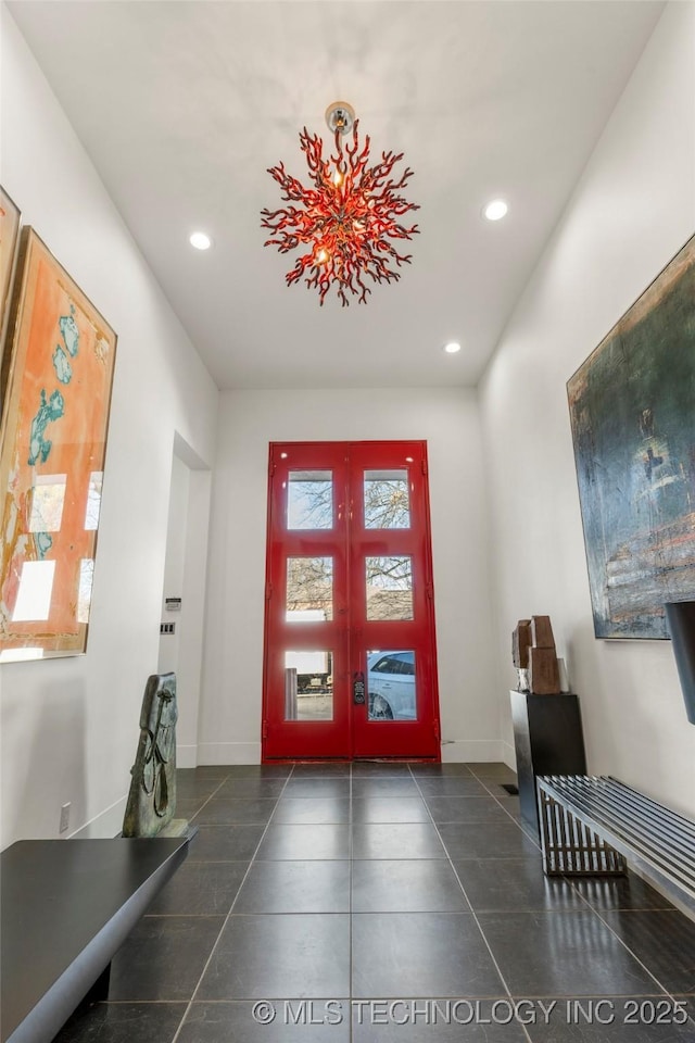 foyer entrance featuring recessed lighting, baseboards, and french doors