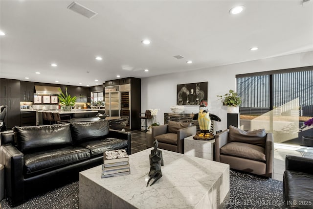 2440 E 47th Pl, Tulsa, OK 74105 - living room featuring recessed lighting