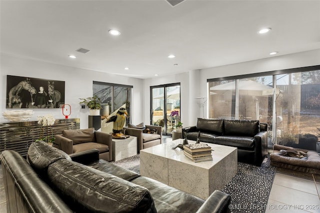 living area with tile patterned floors, recessed lighting, and visible vents