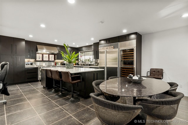 dining area with beverage cooler and recessed lighting