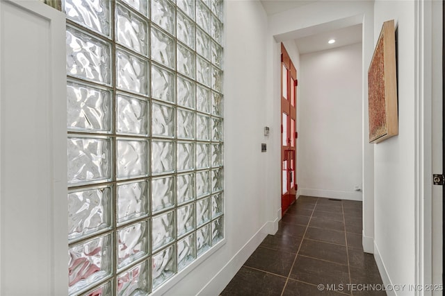 2440 E 47th Pl, Tulsa, OK 74105 - hallway with baseboards, dark tile patterned floors, and recessed lighting