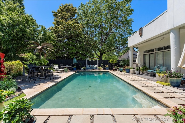 2440 E 47th Pl, Tulsa, OK 74105 - view of swimming pool featuring a patio and a fenced backyard