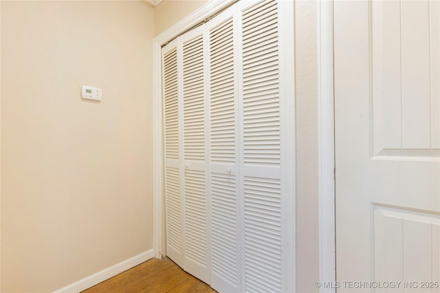 details featuring baseboards and wood finished floors