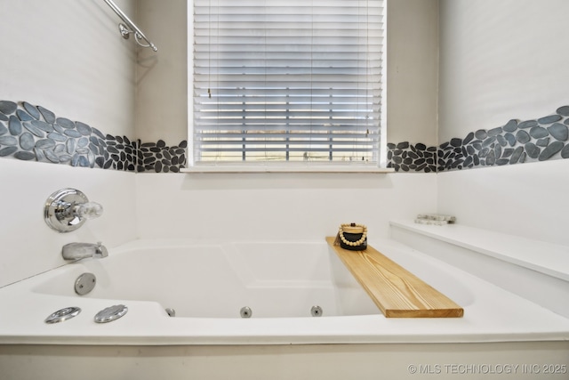 full bath featuring a whirlpool tub