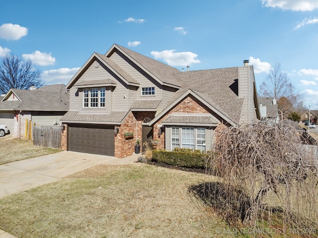 view of front of property featuring brick siding, fence, concrete driveway, a front yard, and a garage