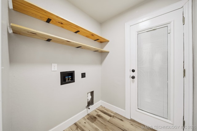 clothes washing area with electric dryer hookup, light wood-type flooring, washer hookup, baseboards, and laundry area