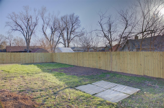 view of yard featuring a fenced backyard