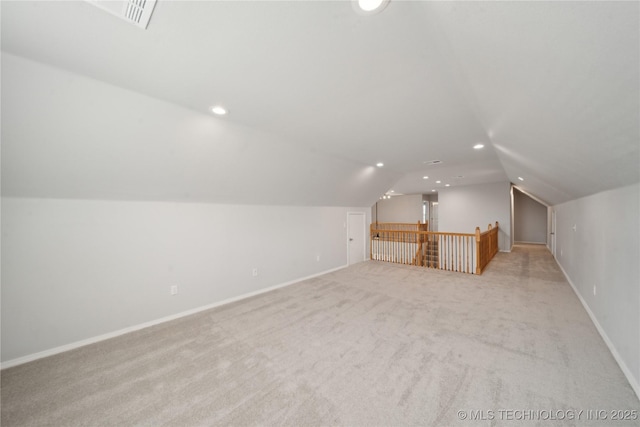 bonus room featuring recessed lighting, baseboards, light carpet, and vaulted ceiling