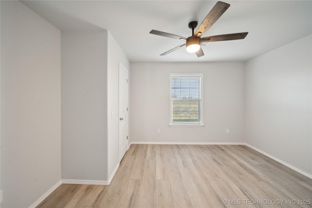 unfurnished room with ceiling fan, baseboards, and light wood-style floors