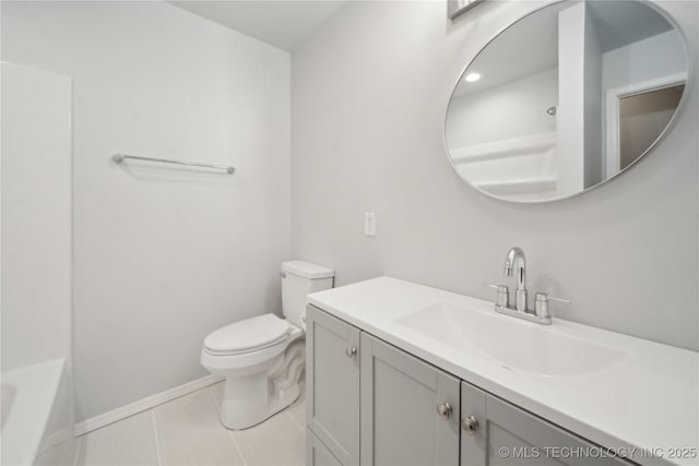 full bathroom featuring baseboards, toilet, a bath, tile patterned floors, and vanity