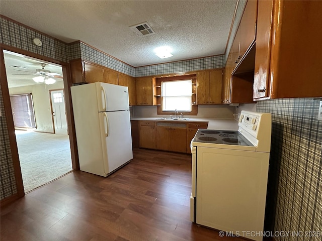 kitchen featuring visible vents, open shelves, a sink, a textured ceiling, and white appliances