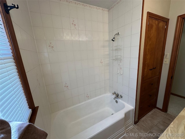 bathroom featuring tile patterned flooring and tub / shower combination