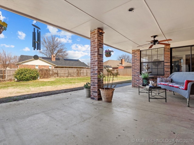 view of patio / terrace featuring an outdoor hangout area, a fenced backyard, and ceiling fan