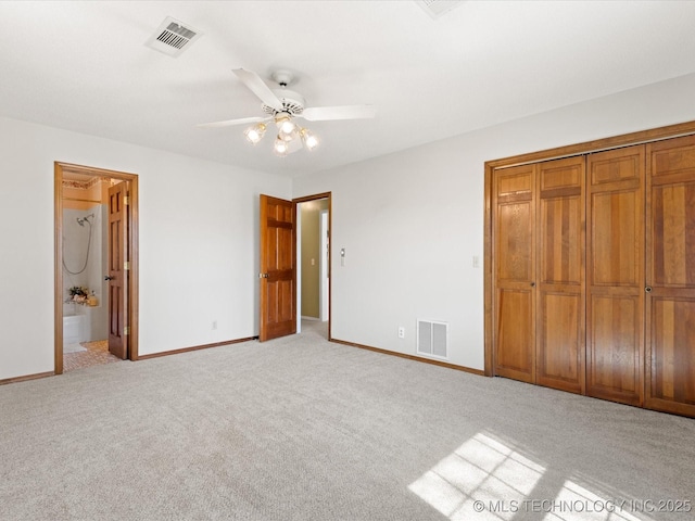 unfurnished bedroom with ceiling fan, light colored carpet, visible vents, and baseboards