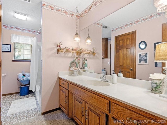 full bath featuring vanity, visible vents, shower / bathtub combination with curtain, and baseboards