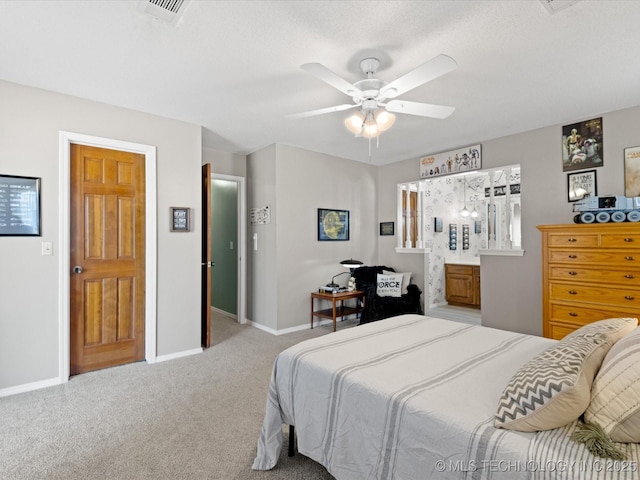 bedroom featuring carpet flooring, baseboards, visible vents, and ceiling fan