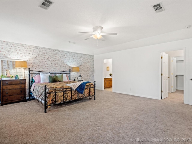 carpeted bedroom featuring baseboards, visible vents, and ceiling fan