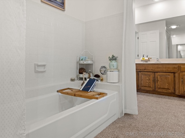 full bathroom with a bathtub and vanity