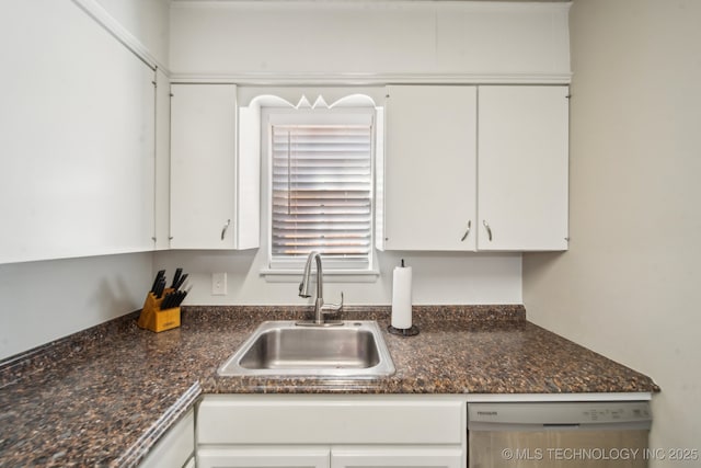 kitchen with a sink, dishwasher, and white cabinetry