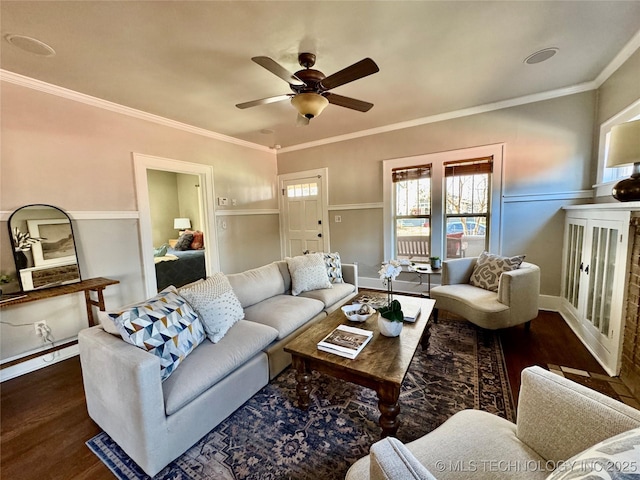 living room with ornamental molding, ceiling fan, and wood finished floors