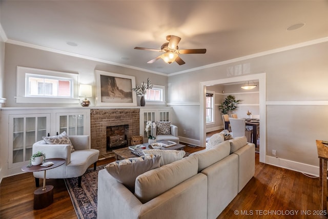 living room with baseboards, a fireplace, ceiling fan, and dark wood-style flooring