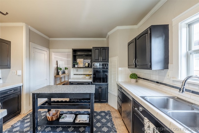 kitchen featuring oven, open shelves, a sink, stainless steel dishwasher, and a healthy amount of sunlight