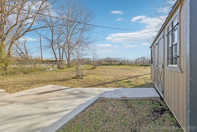 view of yard with a patio and fence