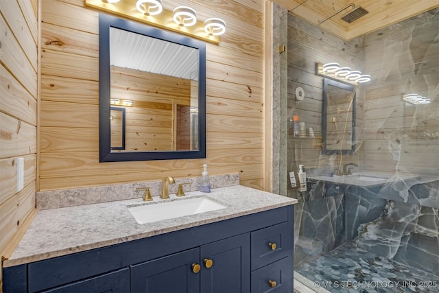 bathroom with vanity and a stall shower