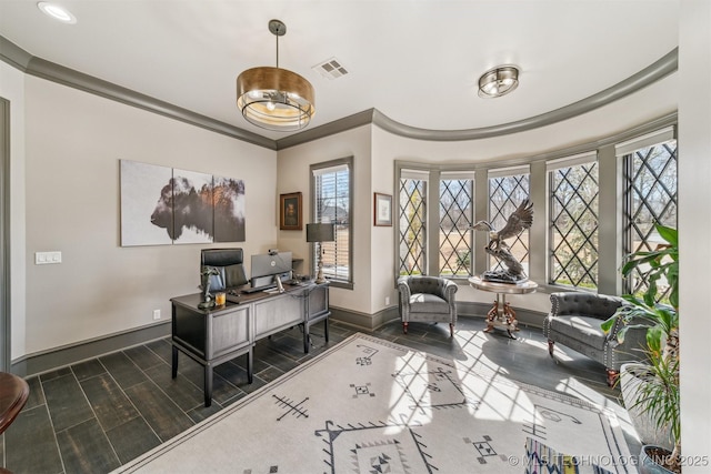 office area featuring visible vents, a healthy amount of sunlight, crown molding, and baseboards