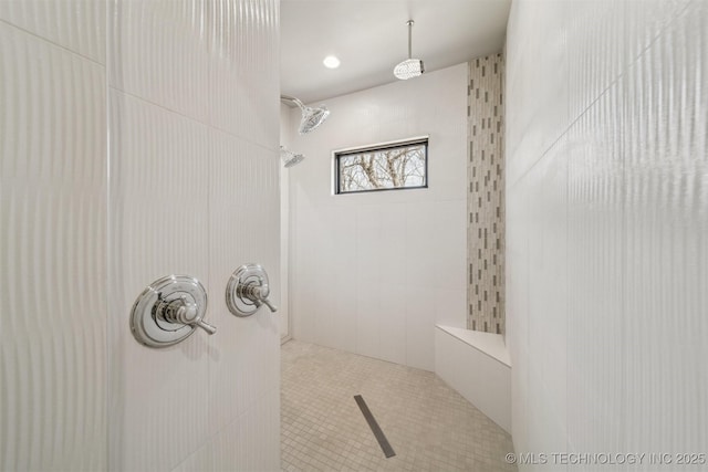 bathroom with tiled shower