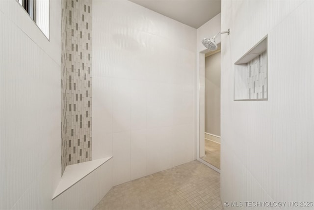 bathroom with tiled shower