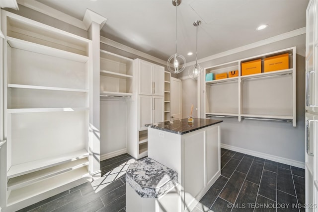 spacious closet with wood finish floors